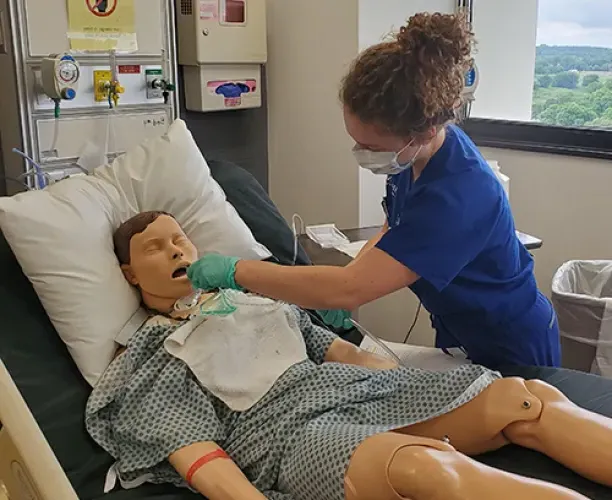 Nursing student in sim lab